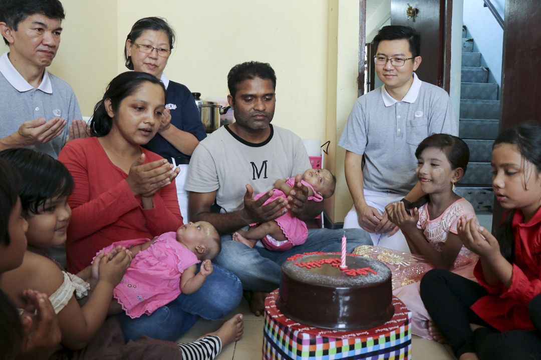 Salim (4th from right) from Myanmar and wife, Rahaatar (5th from right), prayed humbly for peace, love and health to be there for their kids. [Photograph by Yong Mun Fei]